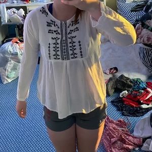 White blouse with grey pattern near the neck!